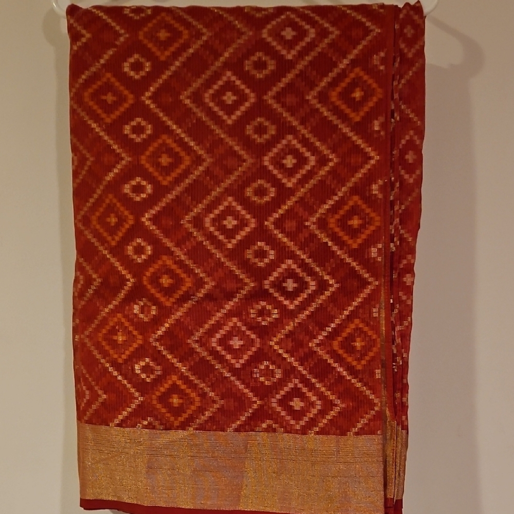 Red and Gold Patterned Fabric or Saree